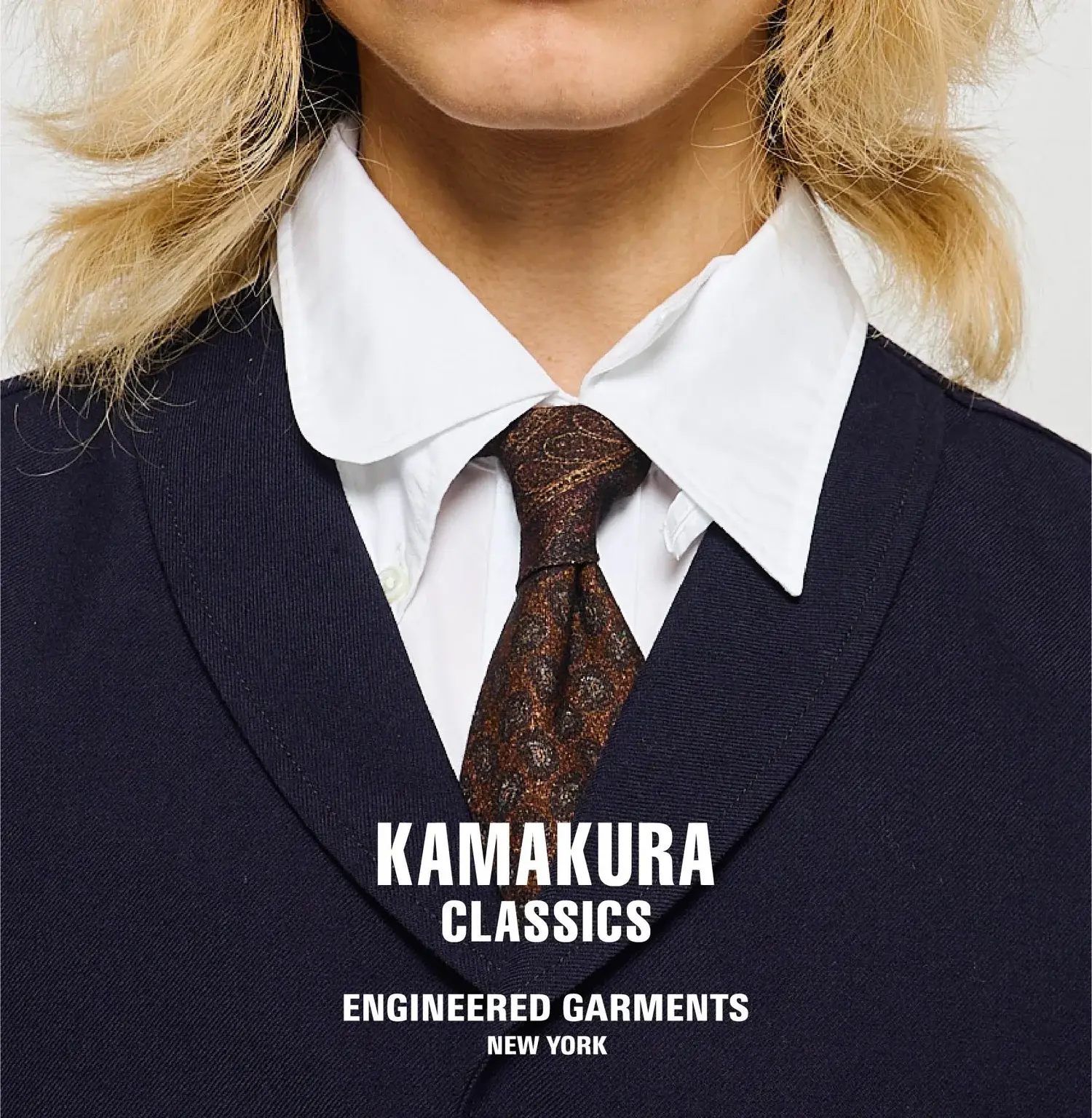 Garments from the Engineered Garments and Kamakura Classics collaboration, styled on a rack