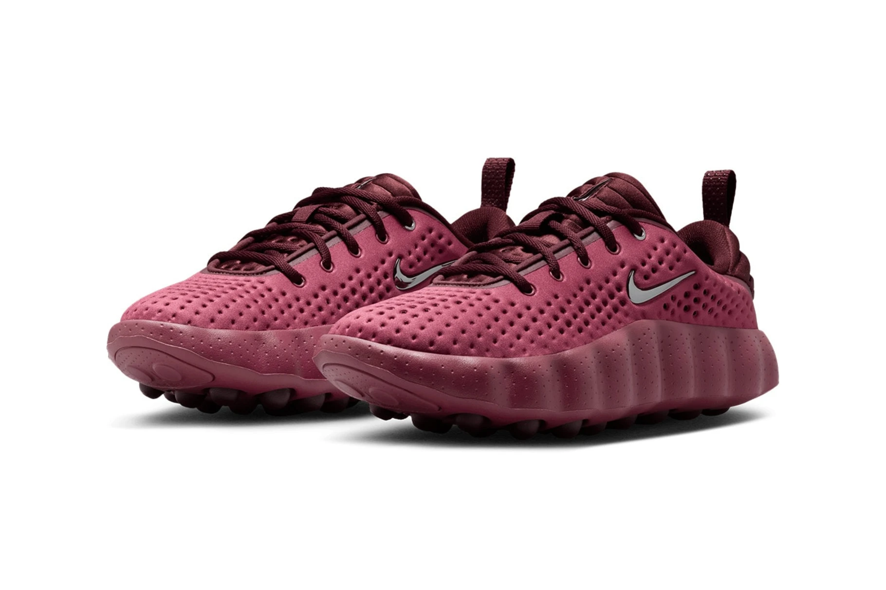 Nike Mind 002 Pink Smoke pair in raspberry tones with metallic silver Swooshes and nodal outsole