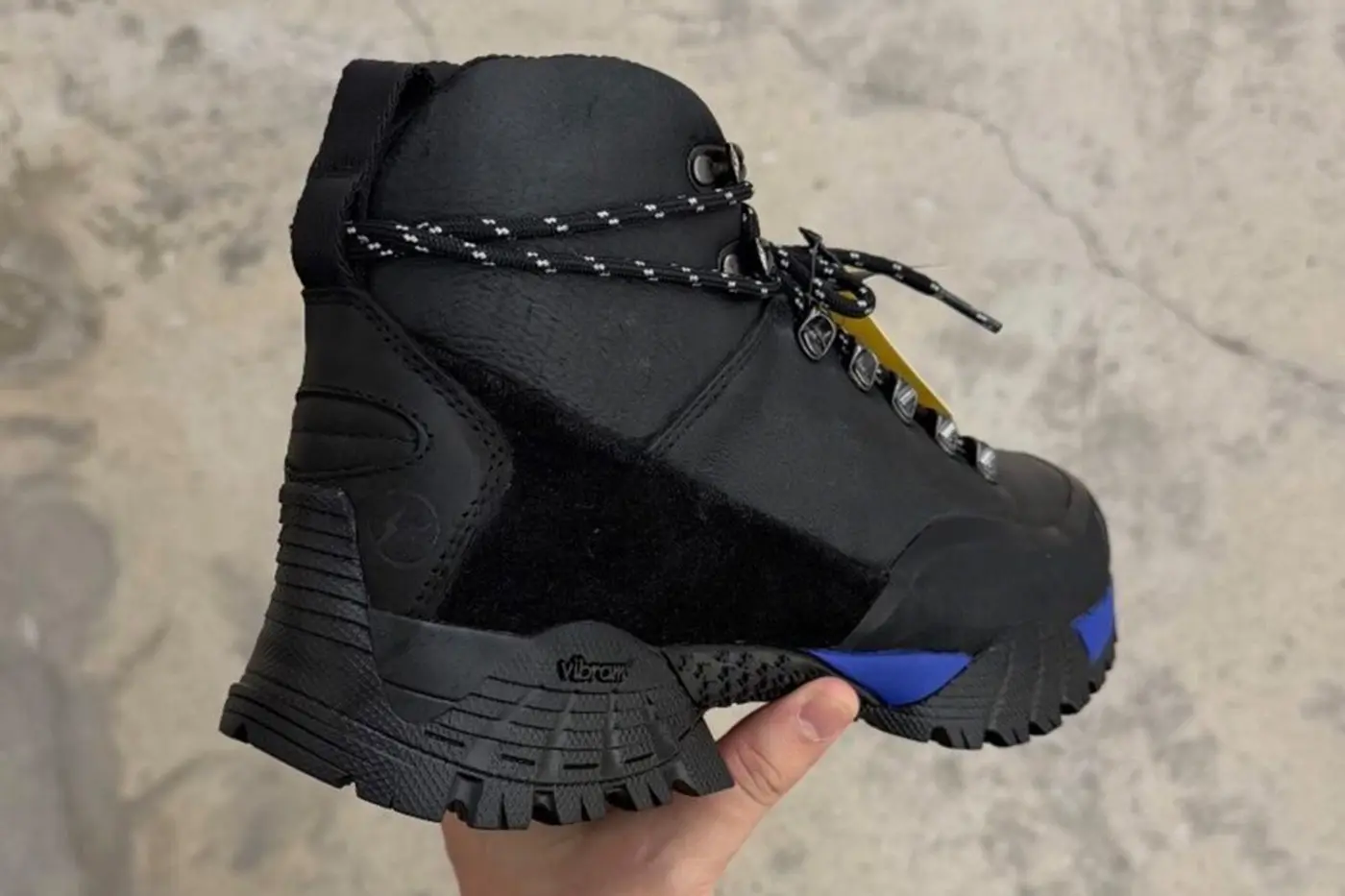 Close detail of the black rubber toe reinforcement on the Andreas boot