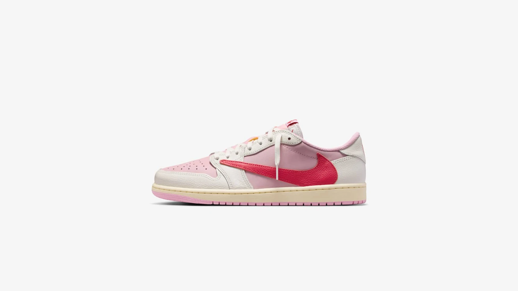 Travis Scott Air Jordan 1 Low in Shy Pink and Tropical Pink with red reverse Swoosh, lateral view